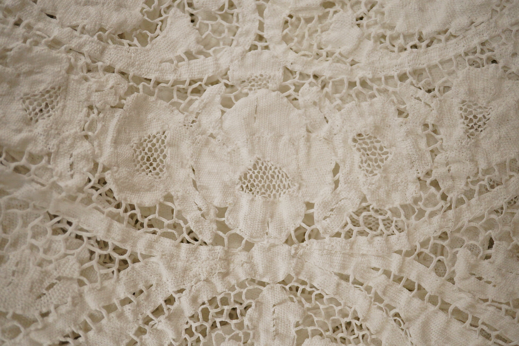 Two ornately designed tape lace bed covers, white cover 152cm x 236cm, beige cover 176cm x 364cm
